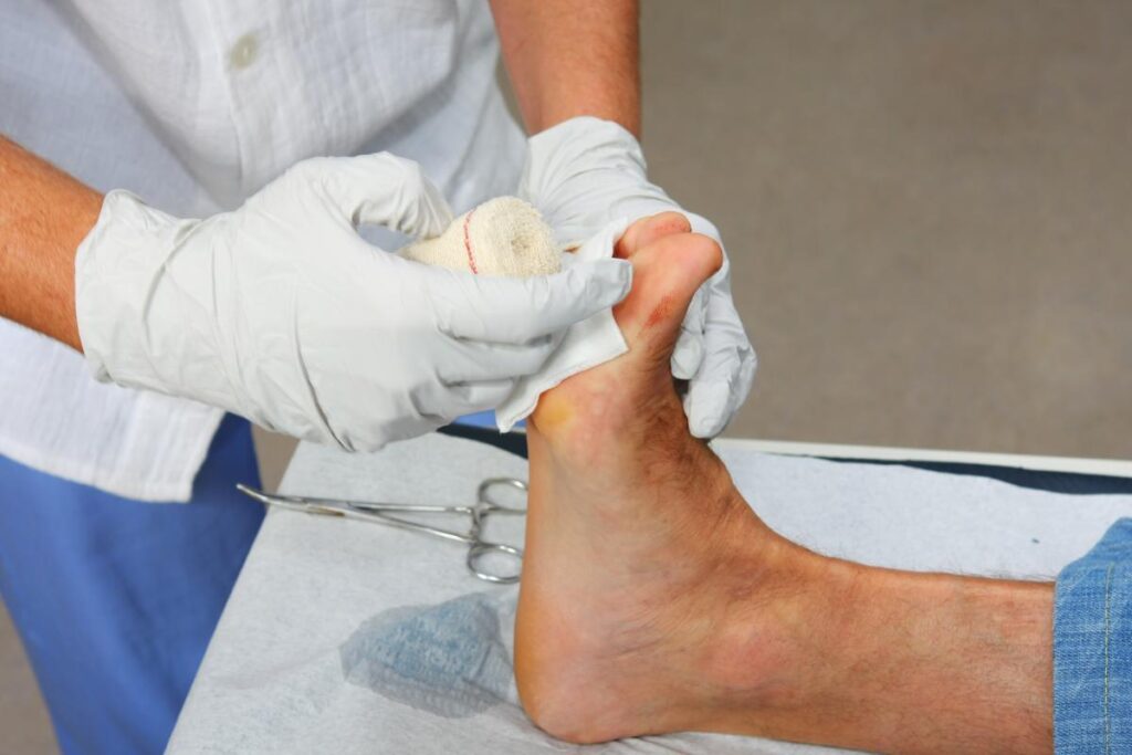 A doctor holding a bandage to a patient's foot